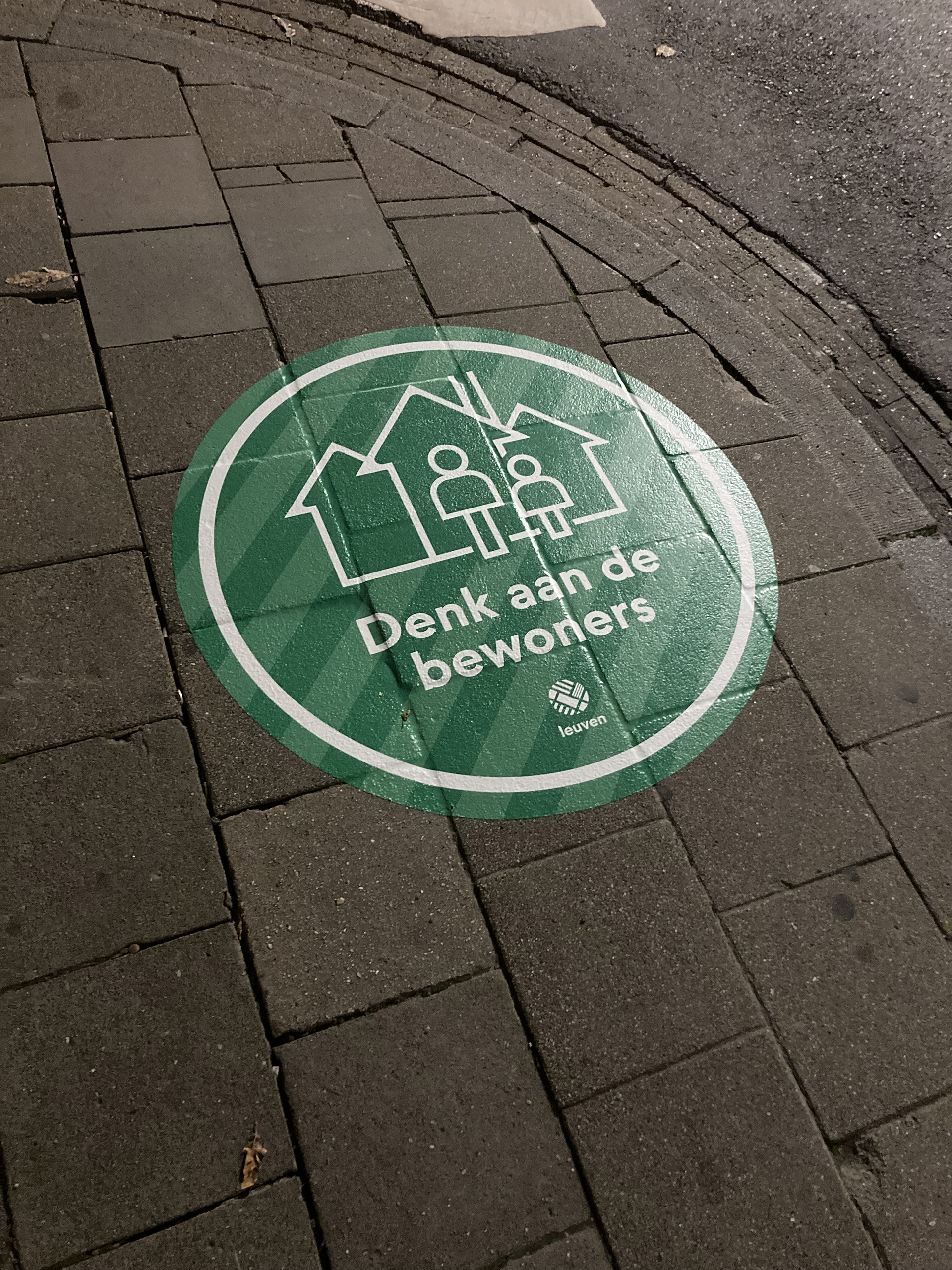 Figure 2 . Example: stickers on the street. Translation of the text in the picture: “Consider the residents.”